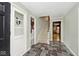Welcoming foyer with slate floors, stairs, and views of rooms beyond at 6115 E 65Th Pl, Indianapolis, IN 46220