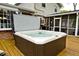 An in-ground hot tub on a wooden deck offers a luxurious and relaxing outdoor experience at 6115 E 65Th Pl, Indianapolis, IN 46220