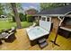 Outdoor hot tub on a wooden deck with lounge chairs, offering a serene backyard retreat at 6115 E 65Th Pl, Indianapolis, IN 46220