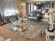 Open floorplan living room featuring unique decor, comfortable seating, and access to the kitchen at 615 Albermarle Dr, Pittsboro, IN 46167