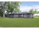 A large backyard features mature trees and green grass at 625 E 106Th St, Carmel, IN 46280