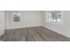 Bedroom with neutral walls and modern gray flooring is bright and airy at 625 E 106Th St, Carmel, IN 46280