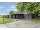 View of a cozy home with a detached garage and a cracked driveway at 625 E 106Th St, Carmel, IN 46280