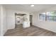 The bright living room with views into the kitchen boasts modern flooring and windows at 625 E 106Th St, Carmel, IN 46280