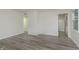 Inviting living room with gray flooring and neutral paint, showcasing a bright and airy space at 625 E 106Th St, Carmel, IN 46280