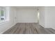 Bright room with gray floors features a white door and trim plus natural light at 625 E 106Th St, Carmel, IN 46280