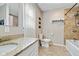Bathroom features a white basin vanity, granite countertop, toilet, and a combination shower and tub at 6450 N State Road 75, North Salem, IN 46165