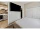 Bedroom features carpet, double closet, ceiling light and doorway to laundry area at 6450 N State Road 75, North Salem, IN 46165