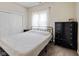 Bedroom with carpet features white walls, updated furniture, and a window with sheer curtains at 6450 N State Road 75, North Salem, IN 46165