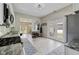 The kitchen has stainless steel appliances, white cabinets, and backyard access at 6450 N State Road 75, North Salem, IN 46165