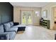 This living room boasts a nice blue couch and french doors for access to the backyard at 6450 N State Road 75, North Salem, IN 46165