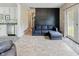 Open concept living room shows new floor, dark accent wall and sliding glass doors to outside at 6450 N State Road 75, North Salem, IN 46165