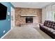 The cozy living room features a brick fireplace, and an adjacent doorway at 6450 N State Road 75, North Salem, IN 46165