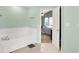 Bathroom featuring a door opening to the bedroom and a tub with jets at 7312 Drum Castle Ct, Indianapolis, IN 46259