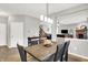 Warm dining area featuring a modern light fixture and views of the entry at 7312 Drum Castle Ct, Indianapolis, IN 46259