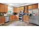 Spacious kitchen boasts stainless steel appliances and ample cabinet storage at 7312 Drum Castle Ct, Indianapolis, IN 46259