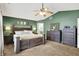 Spacious main bedroom suite with a king-sized bed, stylish furnishings, and an en-suite bathroom at 7312 Drum Castle Ct, Indianapolis, IN 46259