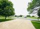 Quiet neighborhood street with mature trees, well-kept lawns, and a welcoming atmosphere at 7312 Drum Castle Ct, Indianapolis, IN 46259