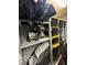 Organized storage area featuring shelving units, storage bins, and various equipment at 7312 Drum Castle Ct, Indianapolis, IN 46259