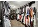 Walk-in closet offering ample storage with built-in shelving for clothes and shoes at 7312 Drum Castle Ct, Indianapolis, IN 46259