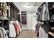 Walk-in closet provides an abundance of space with shelving and closet rods at 7312 Drum Castle Ct, Indianapolis, IN 46259