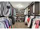Well-organized walk-in closet with custom shelving and hanging space for storage at 7312 Drum Castle Ct, Indianapolis, IN 46259