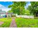 Beautifully landscaped backyard with brick walkway and garden area at 7414 Mendenhall Rd, Camby, IN 46113