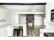 Well-equipped kitchen features sleek countertops, stainless steel appliances, and convenient breakfast bar seating at 7414 Mendenhall Rd, Camby, IN 46113