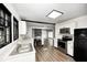 Open-concept kitchen boasts modern appliances, sleek countertops, and seamless flow into a bright living area at 7414 Mendenhall Rd, Camby, IN 46113