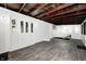 Bright sunroom features beautiful wood plank ceiling, wood-look flooring and multiple windows at 7414 Mendenhall Rd, Camby, IN 46113