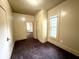Cozy bedroom features a window for natural light, neutral walls, and easy access to other rooms at 745 N Tremont St, Indianapolis, IN 46222