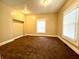 Cozy bedroom featuring two windows and a spacious closet at 745 N Tremont St, Indianapolis, IN 46222