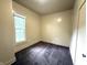 Carpeted bedroom with neutral walls and natural lighting, accented by a large window at 745 N Tremont St, Indianapolis, IN 46222