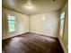 Bright and airy room with neutral walls, carpet, and windows offering ample natural light throughout the home at 745 N Tremont St, Indianapolis, IN 46222