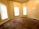 Bright bedroom featuring three windows and neutral colored walls at 745 N Tremont St, Indianapolis, IN 46222