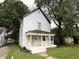 Traditional two-story home surrounded by mature trees and greenery at 745 N Tremont St, Indianapolis, IN 46222