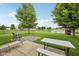 Spacious backyard with a lush lawn, swing set, and picnic table, perfect for outdoor entertaining at 764 Port Dr, Avon, IN 46123