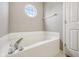 Corner bathtub with faucet fixture and octagon window for natural light at 764 Port Dr, Avon, IN 46123