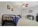 Comfortable bedroom featuring a ceiling fan, bed, desk, and charming baseball decor at 764 Port Dr, Avon, IN 46123
