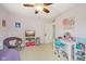 Bright bedroom with fun decorations, ceiling fan, desk, chair, and ample storage space at 764 Port Dr, Avon, IN 46123