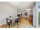 View of dining area leading to the brick fireplace and work space at 764 Port Dr, Avon, IN 46123