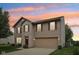 Charming two-story home with a brick and vinyl exterior and a two-car attached garage at 764 Port Dr, Avon, IN 46123
