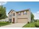 Charming two-story home with a brick and siding exterior, attached garage, and well-manicured lawn at 764 Port Dr, Avon, IN 46123