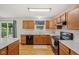Traditional-style kitchen featuring wood cabinets and a black appliance suite at 764 Port Dr, Avon, IN 46123