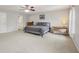 Bright main bedroom with carpet, ceiling fan, and a desk area with natural light at 764 Port Dr, Avon, IN 46123