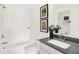 Modern bathroom with white bathtub, vanity, and decorative artwork at 8781 Marietta Ln, McCordsville, IN 46055