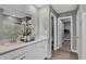 Elegant bathroom with dual sinks, a walk-in closet, and a view of the shower at 8784 Alexander Ridge Dr, McCordsville, IN 46055