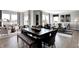 Inviting dining and living area with stylish furniture, seamlessly blending comfort and sophistication for modern living at 8784 Alexander Ridge Dr, McCordsville, IN 46055