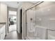 Modern bathroom featuring a glass enclosed shower, a towel on the door, and gray flooring at 8856 Alexander Ridge Dr, McCordsville, IN 46055