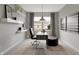 Bright study featuring a window, sleek desk, shelves, and contemporary decor for a modern workspace at 8856 Alexander Ridge Dr, McCordsville, IN 46055